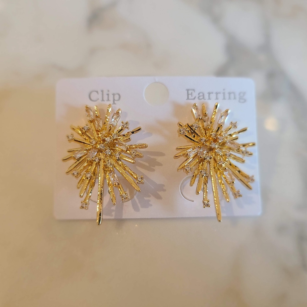 Gold tone rhinestone burst stud earrings